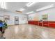 Bright garage with ample space, equipped with storage cabinets and natural light at 203 Shelby Ln, Fayetteville, GA 30215