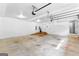 Spacious garage with modern door opener, white walls, and convenient interior entry at 203 Shelby Ln, Fayetteville, GA 30215