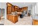 Spacious kitchen with custom cabinets, stainless appliances, and granite countertops at 203 Shelby Ln, Fayetteville, GA 30215