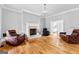 Spacious living room features a fireplace and ample seating, perfect for relaxation at 203 Shelby Ln, Fayetteville, GA 30215