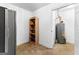 Functional utility room with water heater, shelving, and extra storage space at 203 Shelby Ln, Fayetteville, GA 30215