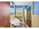Bathroom with vintage style sink, tile shower, and bright blue walls at 2531 Hood Nw Ave, Atlanta, GA 30318