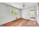 Bedroom with hardwood floors, ceiling fan, and bright natural light at 2531 Hood Nw Ave, Atlanta, GA 30318