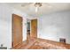 Bedroom with hardwood floors, ceiling fan and two closets at 2531 Hood Nw Ave, Atlanta, GA 30318