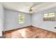 Bedroom featuring hardwood floors, windows, and an air conditioner at 2531 Hood Nw Ave, Atlanta, GA 30318
