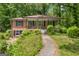 Brick home with a covered front porch and landscaped yard at 2531 Hood Nw Ave, Atlanta, GA 30318