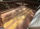 View of the back deck showing the painted boards and wooden railing at 5552 Smithfield Rd, Bowdon, GA 30108
