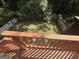The backyard offers privacy with mature trees surrounding the property at 5552 Smithfield Rd, Bowdon, GA 30108