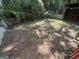 An outdoor backyard showing fence and greenery at 5552 Smithfield Rd, Bowdon, GA 30108