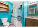 Fun bathroom with colorful walls, a beach-themed shower curtain, and a vanity with storage at 5552 Smithfield Rd, Bowdon, GA 30108