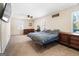 Spacious main bedroom with plush carpet, natural light, and ample space for furnishings at 5552 Smithfield Rd, Bowdon, GA 30108