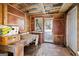 Interior shed view featuring a wooden workbench, pegboard walls, and a window to the exterior at 5552 Smithfield Rd, Bowdon, GA 30108