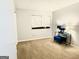 Bedroom featuring plush carpet, a window, and contemporary decor for comfortable relaxation at 1448 Pine Log Ne Rd # C, Conyers, GA 30012