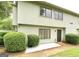 Charming townhome featuring a well-manicured lawn and tidy landscaping with an inviting facade at 1448 Pine Log Ne Rd # C, Conyers, GA 30012