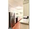 Bright kitchen featuring white cabinets, marble countertops, and stainless steel appliances at 1448 Pine Log Ne Rd # C, Conyers, GA 30012