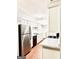 Modern kitchen featuring stainless steel appliances, white cabinets, and a practical in-unit laundry area at 1448 Pine Log Ne Rd # C, Conyers, GA 30012