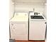 Laundry area featuring a white Amana dryer and Samsung washing machine at 1448 Pine Log Ne Rd # C, Conyers, GA 30012