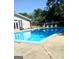 Community pool with plenty of lounge chairs for relaxing and fenced-in area at 1448 Pine Log Ne Rd # C, Conyers, GA 30012