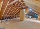 Spacious unfinished attic with exposed rafters offering potential for storage or customization at 45 Plantation Ln, Locust Grove, GA 30248