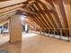 Open attic space showing structural beams, offering plenty of storage at 45 Plantation Ln, Locust Grove, GA 30248