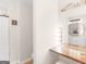 Bright bathroom showing a makeup space next to a full bathroom with a shower at 45 Plantation Ln, Locust Grove, GA 30248