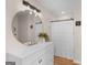Bathroom featuring a vanity with large mirror, good lighting, and a walk-in shower at 45 Plantation Ln, Locust Grove, GA 30248