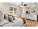 A view of a well-decorated bedroom featuring a large window and dresser with mirrors at 45 Plantation Ln, Locust Grove, GA 30248