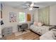 Cozy bedroom with wood laminate flooring, ceiling fan, desk and a modern design at 45 Plantation Ln, Locust Grove, GA 30248
