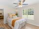 Bright bedroom with a large window, comfortable bed, and stylish decor at 45 Plantation Ln, Locust Grove, GA 30248