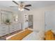 Comfortable bedroom with dresser, mirrors, and a glimpse into a bathroom area at 45 Plantation Ln, Locust Grove, GA 30248