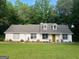 Beautiful home with lush landscaping and manicured lawn, providing a welcoming view and enhanced curb appeal at 45 Plantation Ln, Locust Grove, GA 30248