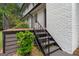 Back porch with black iron railings that lead to stairs and the back yard at 380 Grady Ave, Fayetteville, GA 30214