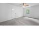 Empty bedroom showcasing plush carpeting, a ceiling fan, and a closet for ample storage at 380 Grady Ave, Fayetteville, GA 30214