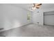 Spacious bedroom with neutral carpet, and a bright window illuminating the room at 380 Grady Ave, Fayetteville, GA 30214