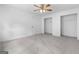 Large bedroom featuring a ceiling fan, closet, and a door leading to other rooms at 380 Grady Ave, Fayetteville, GA 30214