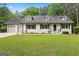 Charming one-story home with a well-manicured lawn and inviting curb appeal at 380 Grady Ave, Fayetteville, GA 30214