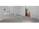 Open living space with hardwood floors and view to a kitchen and window at 380 Grady Ave, Fayetteville, GA 30214