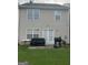 Spacious backyard with a patio, lush green lawn, and outdoor seating at 45 Fieldview Ln, Covington, GA 30016