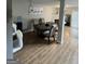 Open dining area featuring wood floors and a view of the fireplace at 45 Fieldview Ln, Covington, GA 30016