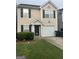 Charming two-story home with attached garage and well-maintained lawn at 45 Fieldview Ln, Covington, GA 30016