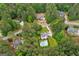 Aerial shot showcasing a home surrounded by lush trees in a quiet neighborhood at 495 Stonehaven Dr, Fayetteville, GA 30215