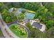 Stunning aerial view of community amenities including pool, clubhouse, and tennis courts at 495 Stonehaven Dr, Fayetteville, GA 30215