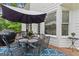 Back deck with outdoor dining set and open views to the yard at 495 Stonehaven Dr, Fayetteville, GA 30215