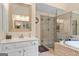 Clean, bright bathroom featuring a white vanity, and glass shower at 495 Stonehaven Dr, Fayetteville, GA 30215
