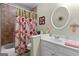 Functional bathroom featuring a tub/shower combo and a white vanity at 495 Stonehaven Dr, Fayetteville, GA 30215
