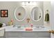 Bathroom featuring a white vanity with double sinks and matching mirrors at 495 Stonehaven Dr, Fayetteville, GA 30215