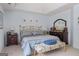 Light-filled bedroom featuring a tray ceiling, and a decorative bench and matching decor at 495 Stonehaven Dr, Fayetteville, GA 30215