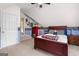 Attic bedroom with unique design elements, including sloped ceilings and sports-themed accents at 495 Stonehaven Dr, Fayetteville, GA 30215