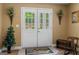 Charming entryway with double doors leading to the outside and decorated with floral arrangements at 495 Stonehaven Dr, Fayetteville, GA 30215