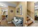 Inviting entryway with a bench, stylish mirror, and staircase to the upper level at 495 Stonehaven Dr, Fayetteville, GA 30215